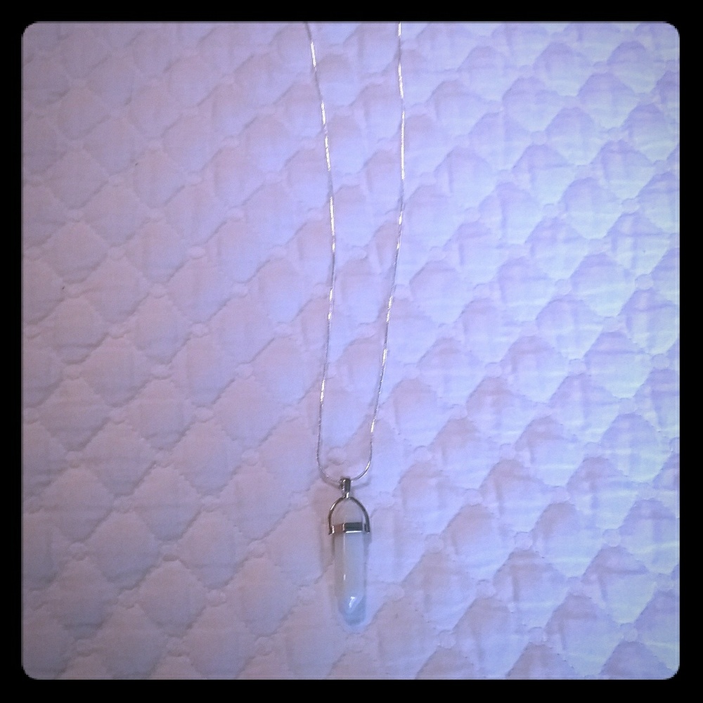A necklace with an opal crystal pendant